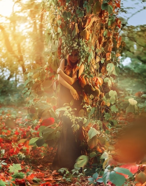 A young girl with long, flowing hair standing at the edge of an ancient, magical forest. Sunlight streams through the trees, illuminating fantastical creatures and vibrant flora.