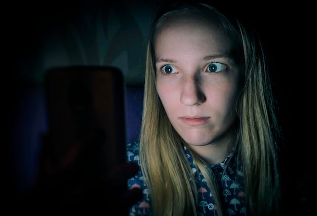 Close-up of a woman's terrified face, lit by the flickering light of a television screen. Her eyes are wide with fear and reflect the disturbing images on the screen.